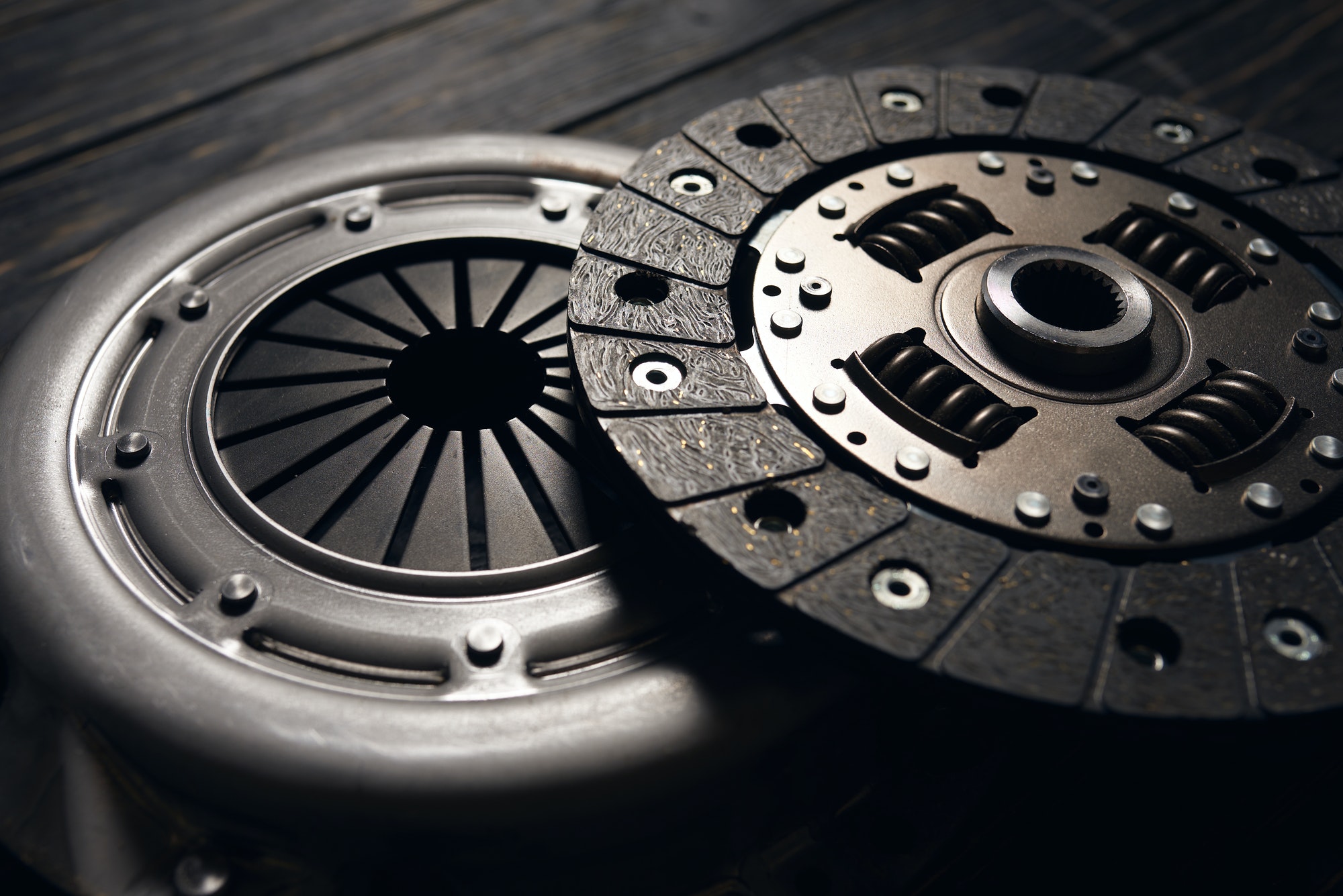 new car clutch kit on a dark wooden background. Close up